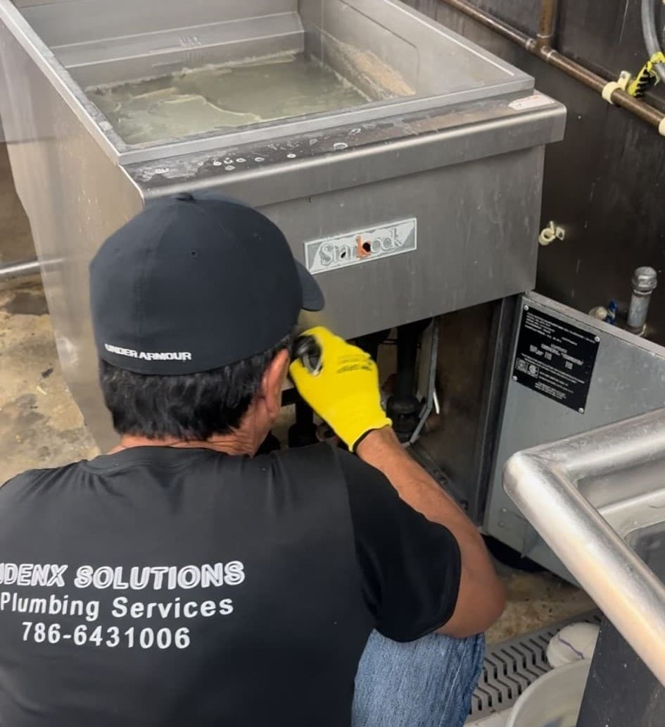 Plumber in Tamiami working on a project